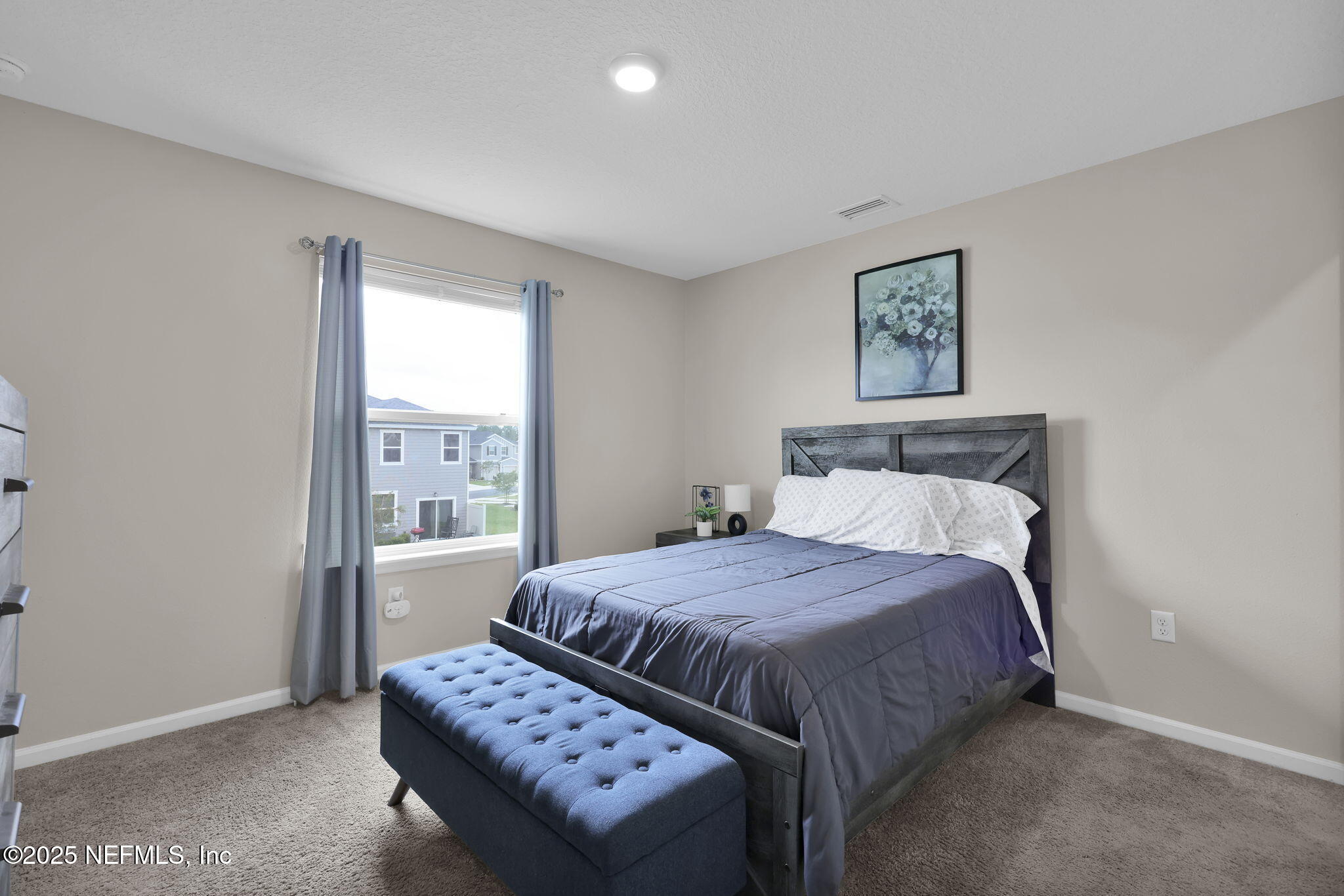 7791 Merchants Way Jacksonville, FL 32222 - Photo 18 of 21 a bedroom with a bed and a window