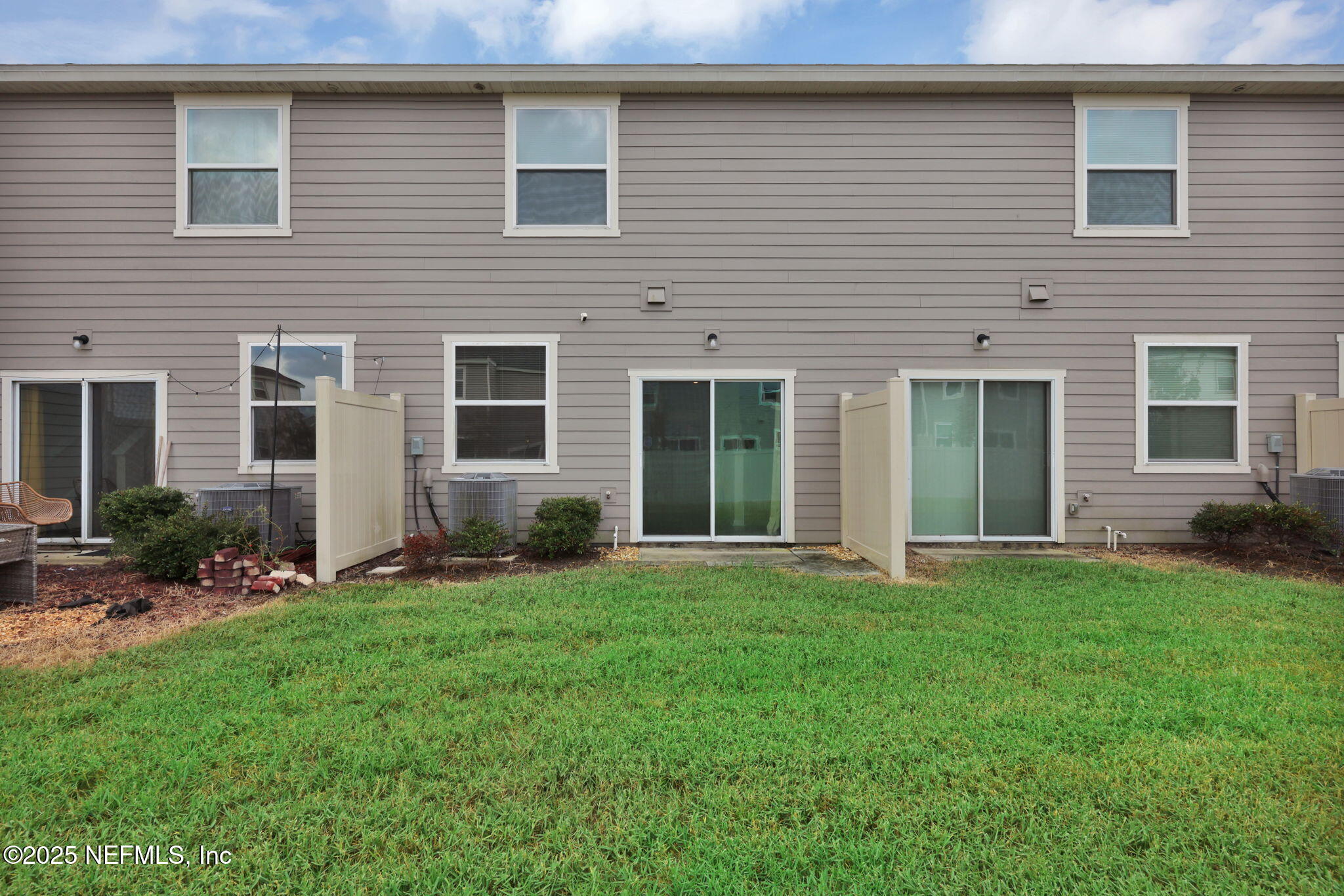 7791 Merchants Way Jacksonville, FL 32222 - Photo 21 of 21 a backyard of a house with yard and outdoor seating