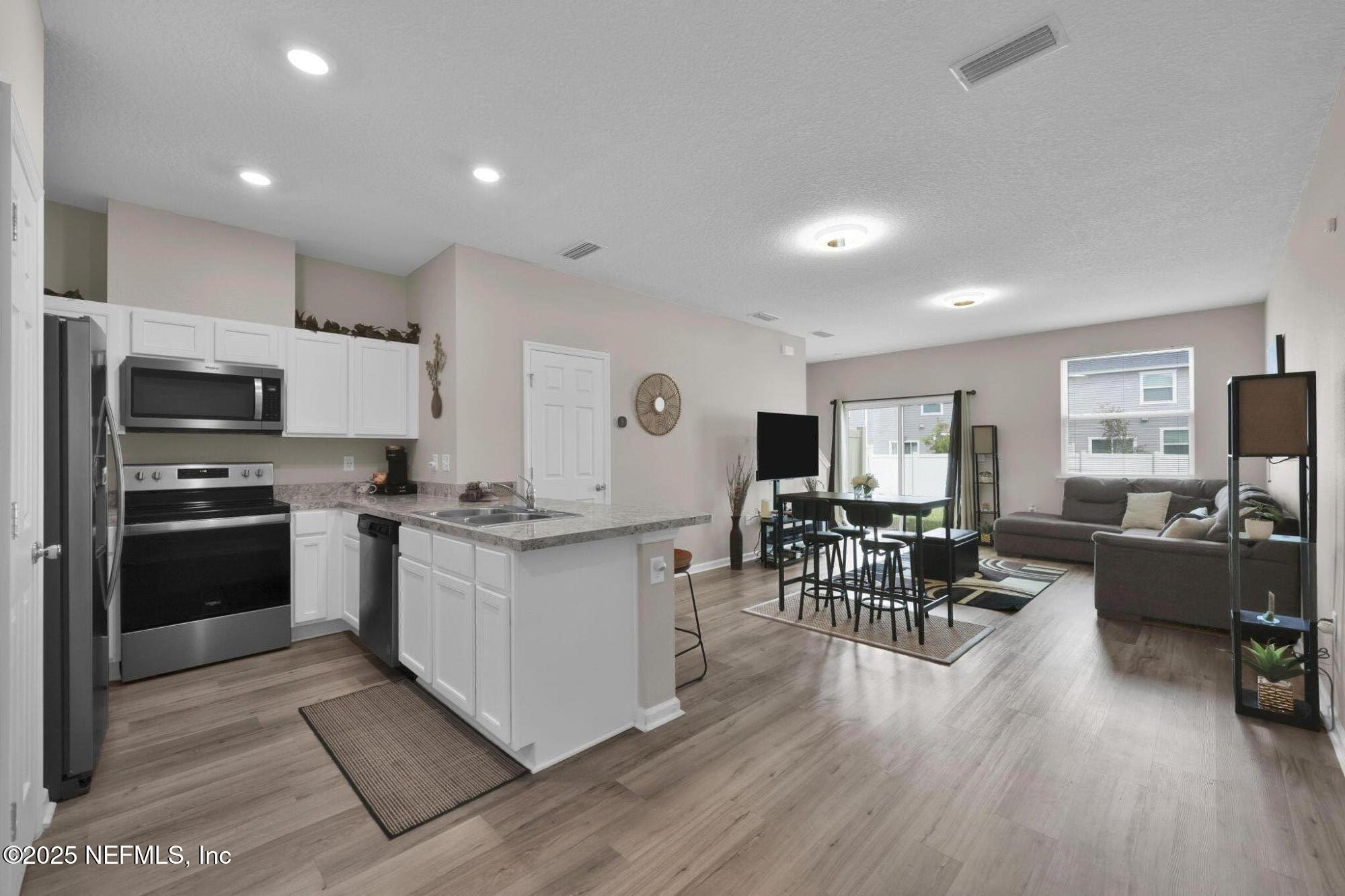 7791 Merchants Way Jacksonville, FL 32222 - Photo 5 of 21 a kitchen with sink cabinets and stainless steel appliances