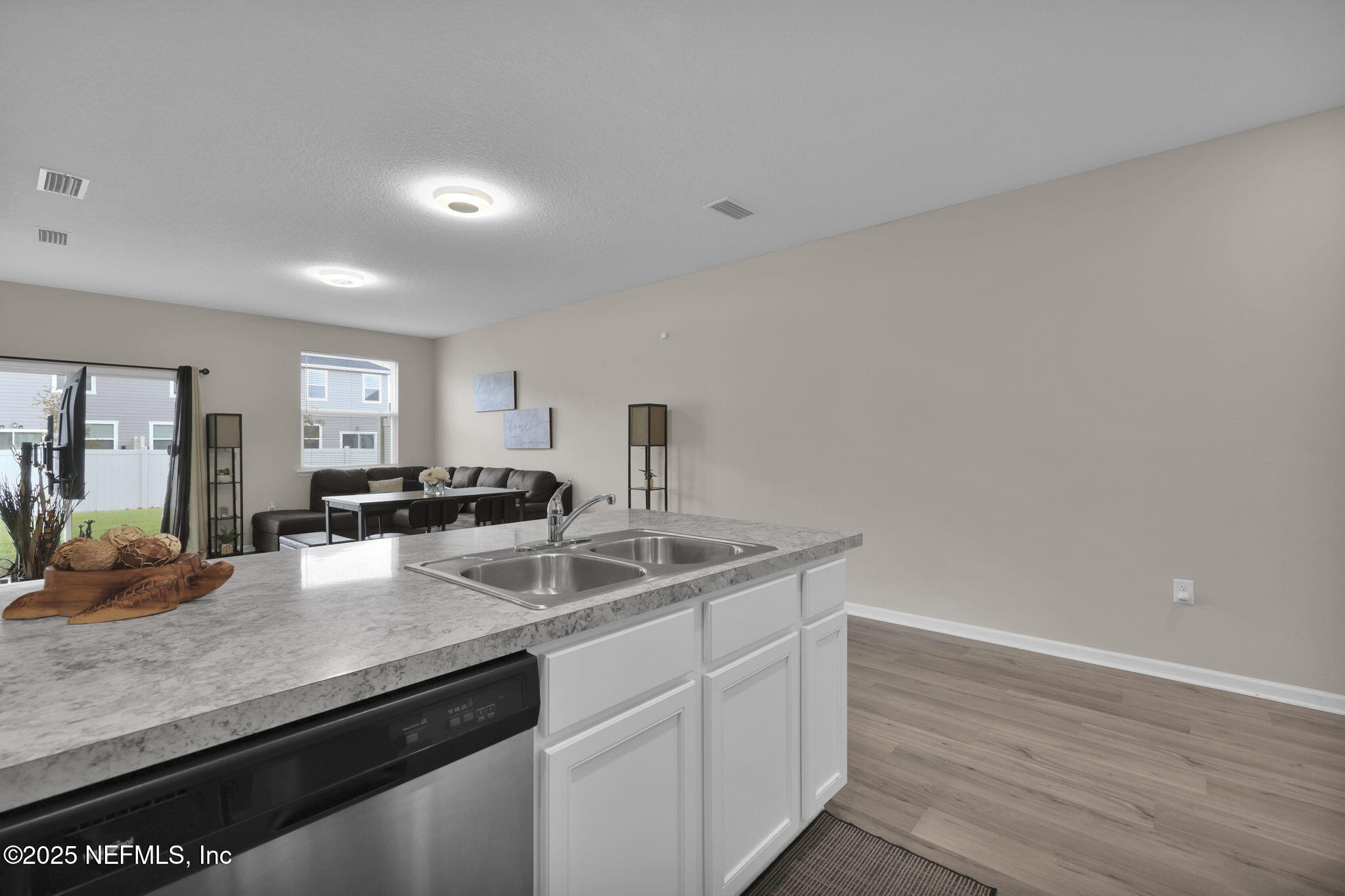 7791 Merchants Way Jacksonville, FL 32222 - Photo 7 of 21 a kitchen with granite countertop a sink and cabinets