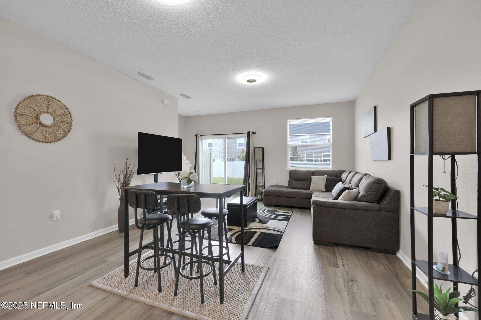 7791 Merchants Way Jacksonville, FL 32222 - Photo 8 of 21 a living room with furniture and a flat screen tv
