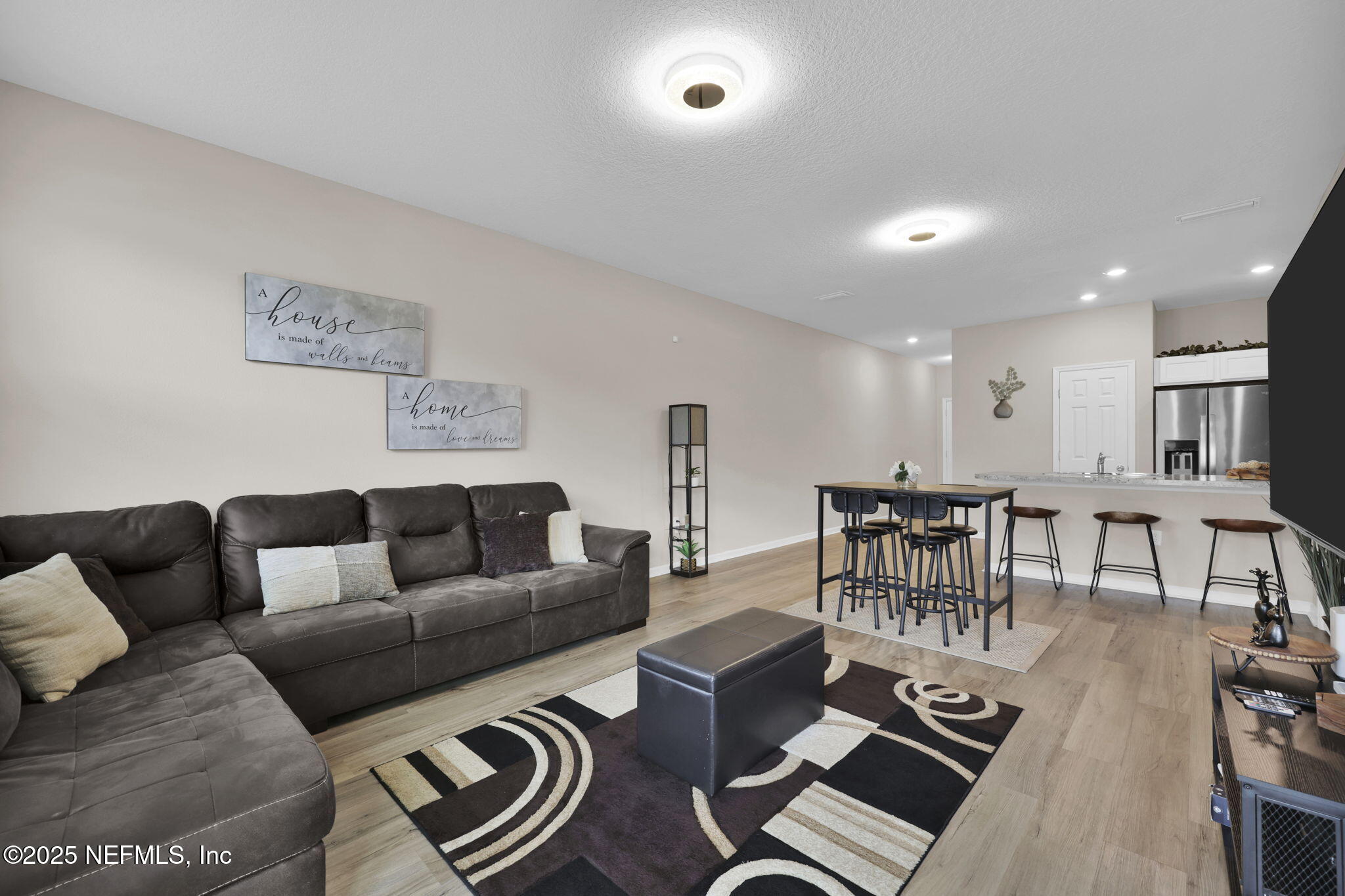 7791 Merchants Way Jacksonville, FL 32222 - Photo 9 of 21 a living room with furniture a wooden floor and a couch