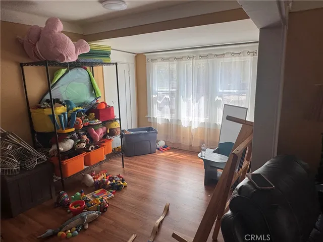 a living room with furniture a rug and a window