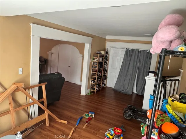 a view of an entryway with wooden floor