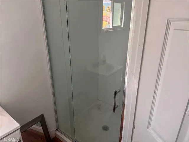 a bathroom with a glass door