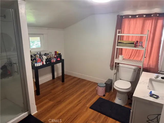 a bathroom with a sink toilet and a shower