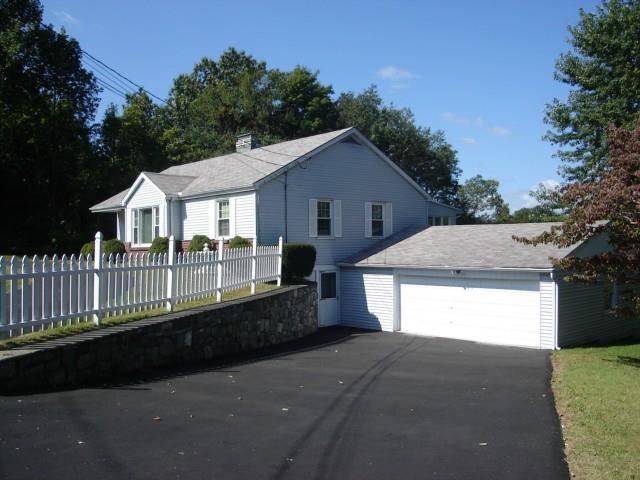 74 Benedict Road Bethel, CT 06801 - Photo 1 of 1 a view of a house with a yard and potted plants