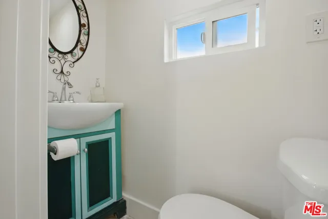 a bathroom with a toilet and a sink