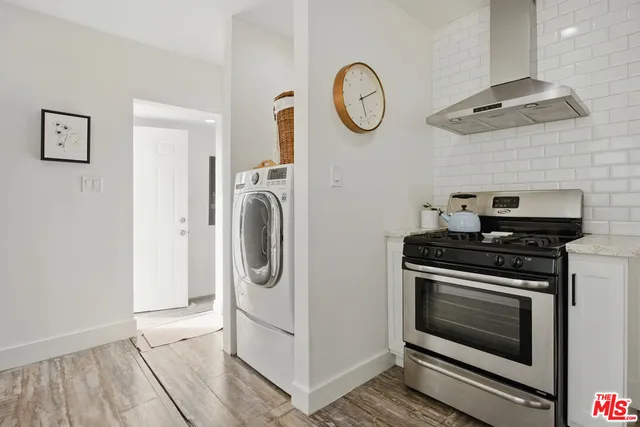 a kitchen with a stove and a microwave