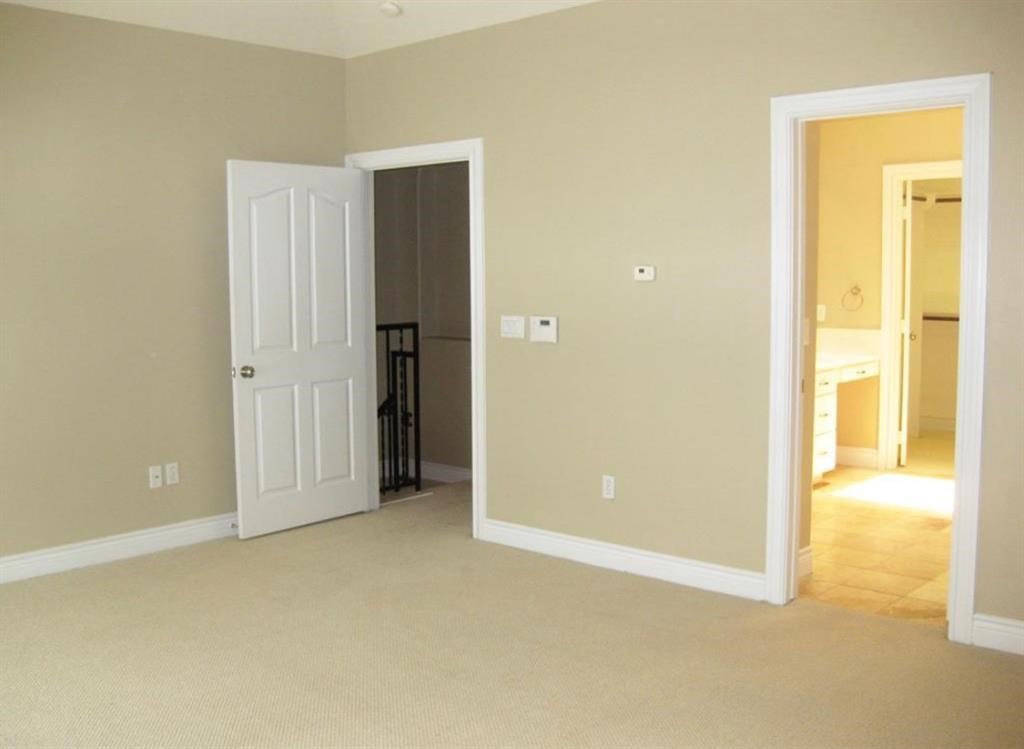 1623 Stuart Street Houston, TX 77004 - Photo 15 of 24 Another view of the primary bedroom which is accented by a trey ceiling and ceiling fan. A second closet is located in this room