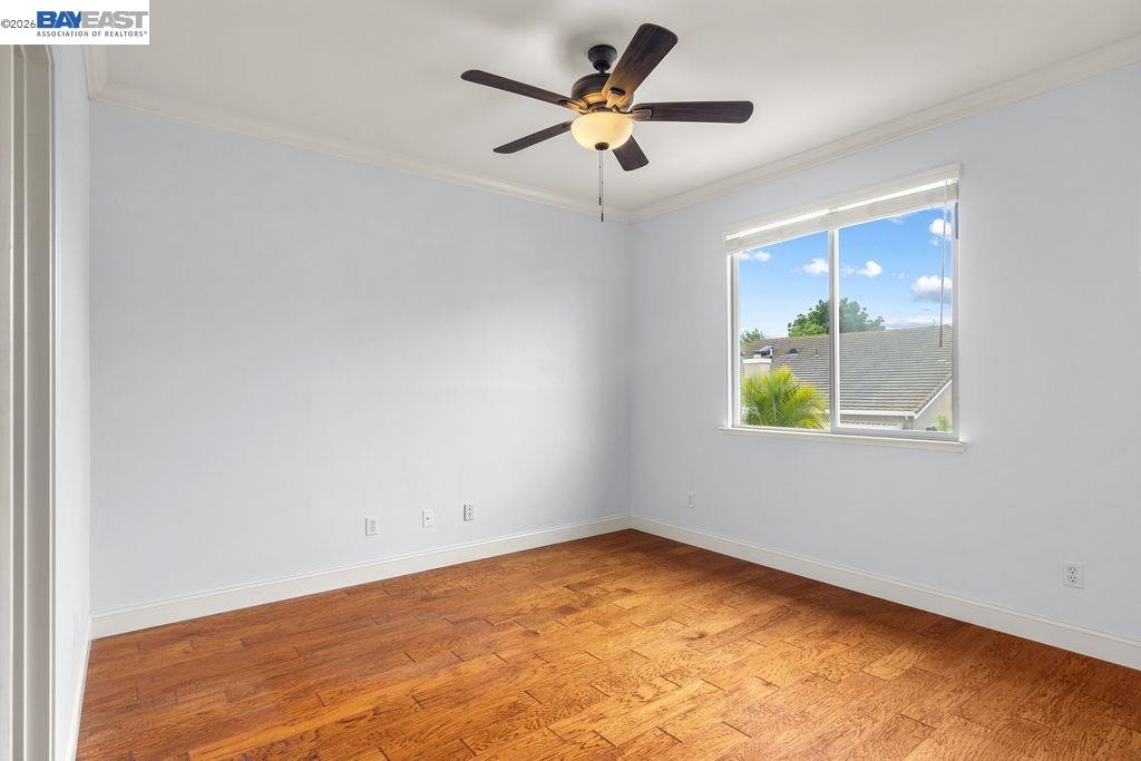 3400 Fallen Oak Drive Modesto, CA 95355 - Photo 19 of 59 an empty room with window and ceiling fan