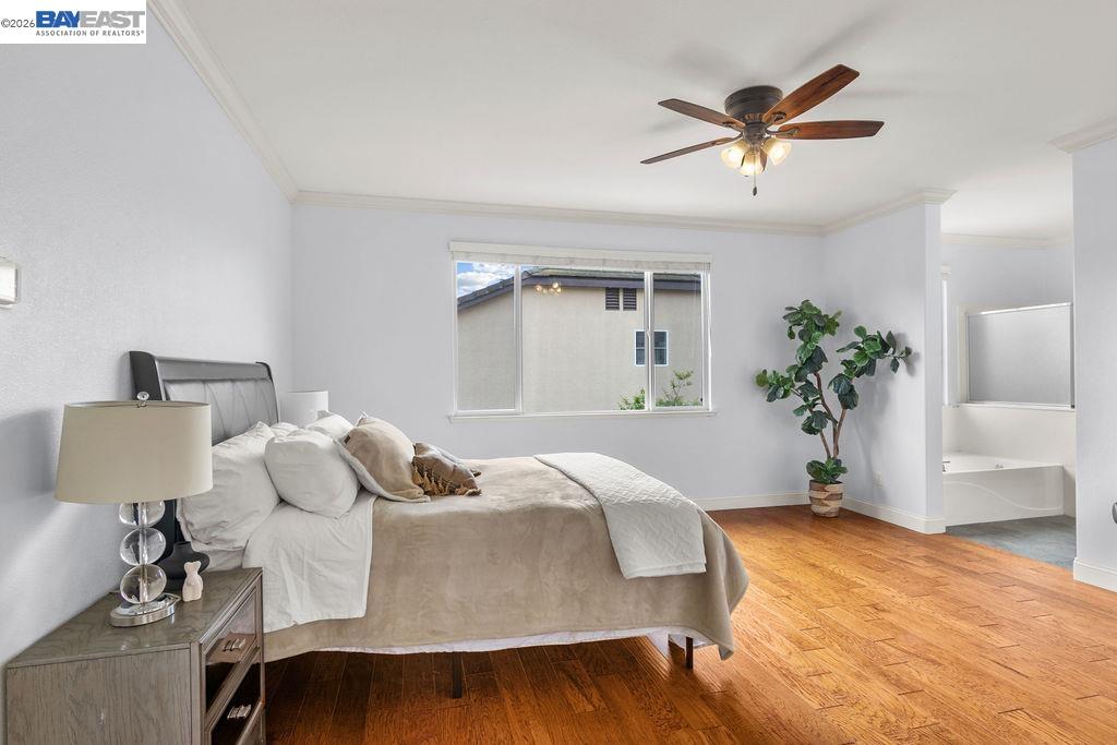 3400 Fallen Oak Drive Modesto, CA 95355 - Photo 21 of 59 a bedroom with a bed and wooden floor
