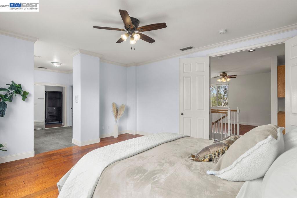 3400 Fallen Oak Drive Modesto, CA 95355 - Photo 23 of 59 a bedroom with a large bed and a chandelier