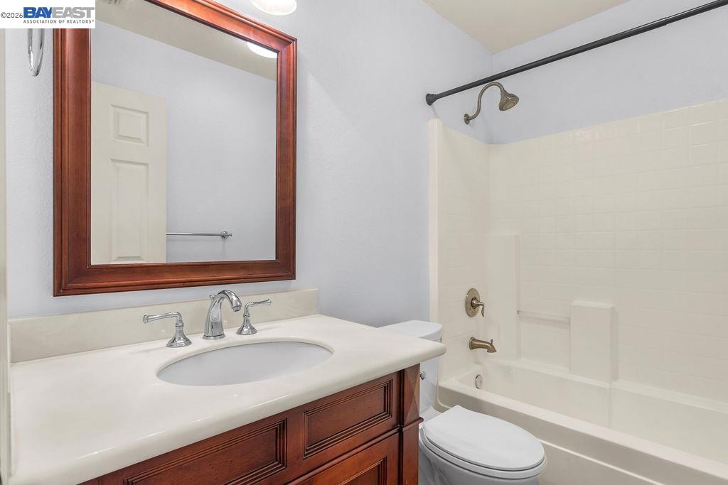 3400 Fallen Oak Drive Modesto, CA 95355 - Photo 32 of 59 a bathroom with a granite countertop sink toilet and shower