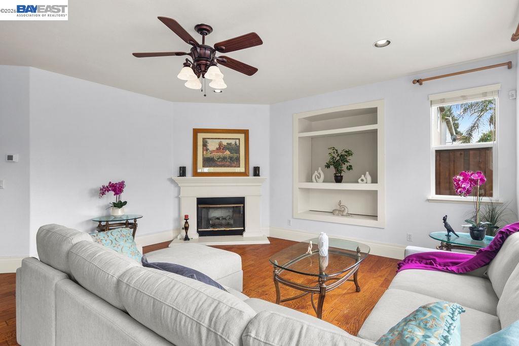 3400 Fallen Oak Drive Modesto, CA 95355 - Photo 42 of 59 a living room with furniture kitchen view and a fireplace