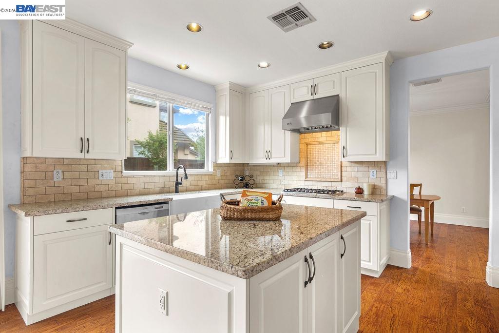 3400 Fallen Oak Drive Modesto, CA 95355 - Photo 45 of 59 a kitchen with a sink stove and cabinets
