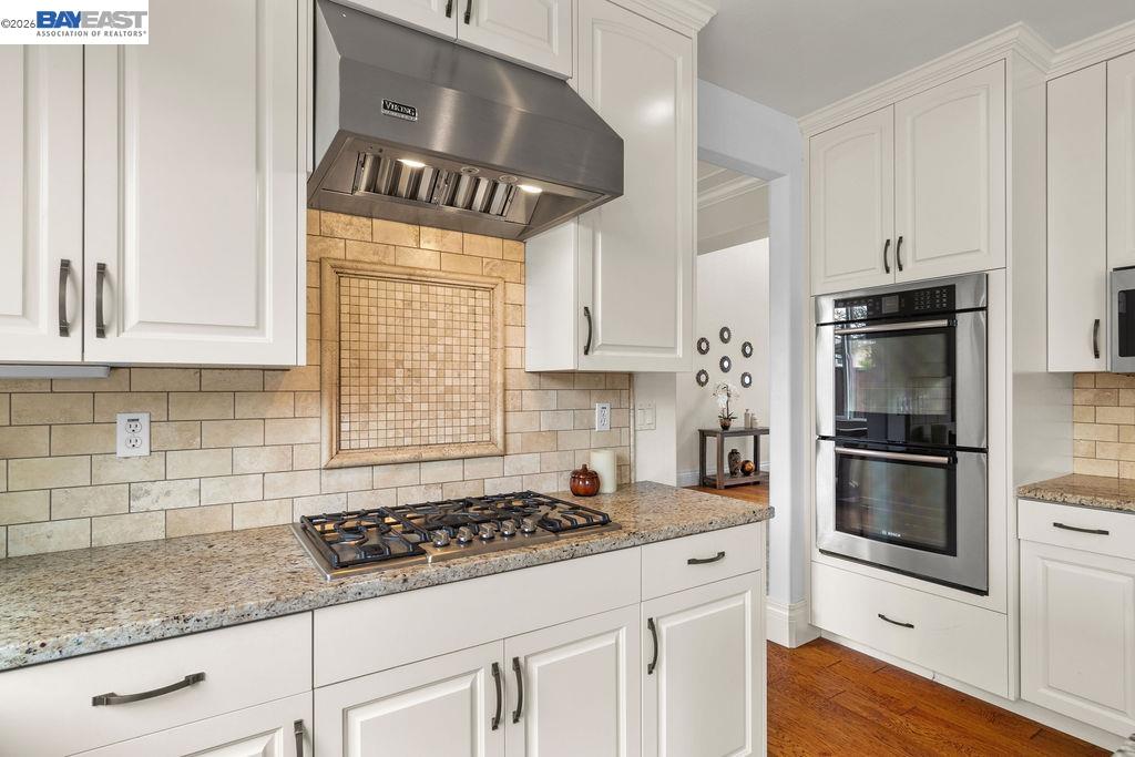 3400 Fallen Oak Drive Modesto, CA 95355 - Photo 47 of 59 a kitchen with granite countertop a stove sink and refrigerator