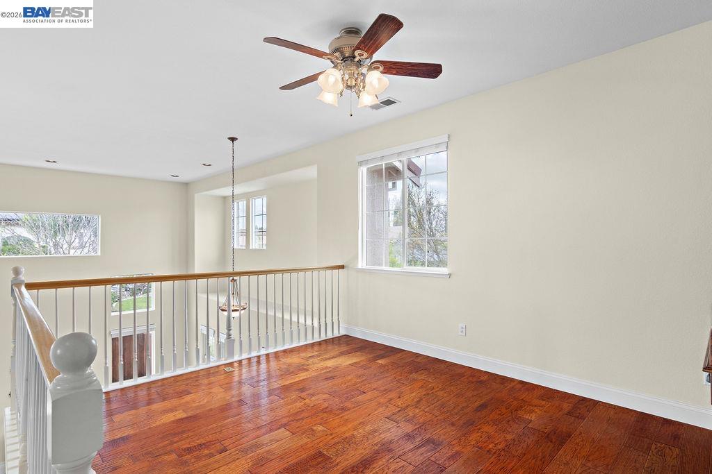 3400 Fallen Oak Drive Modesto, CA 95355 - Photo 9 of 59 a view of an empty room with wooden floor