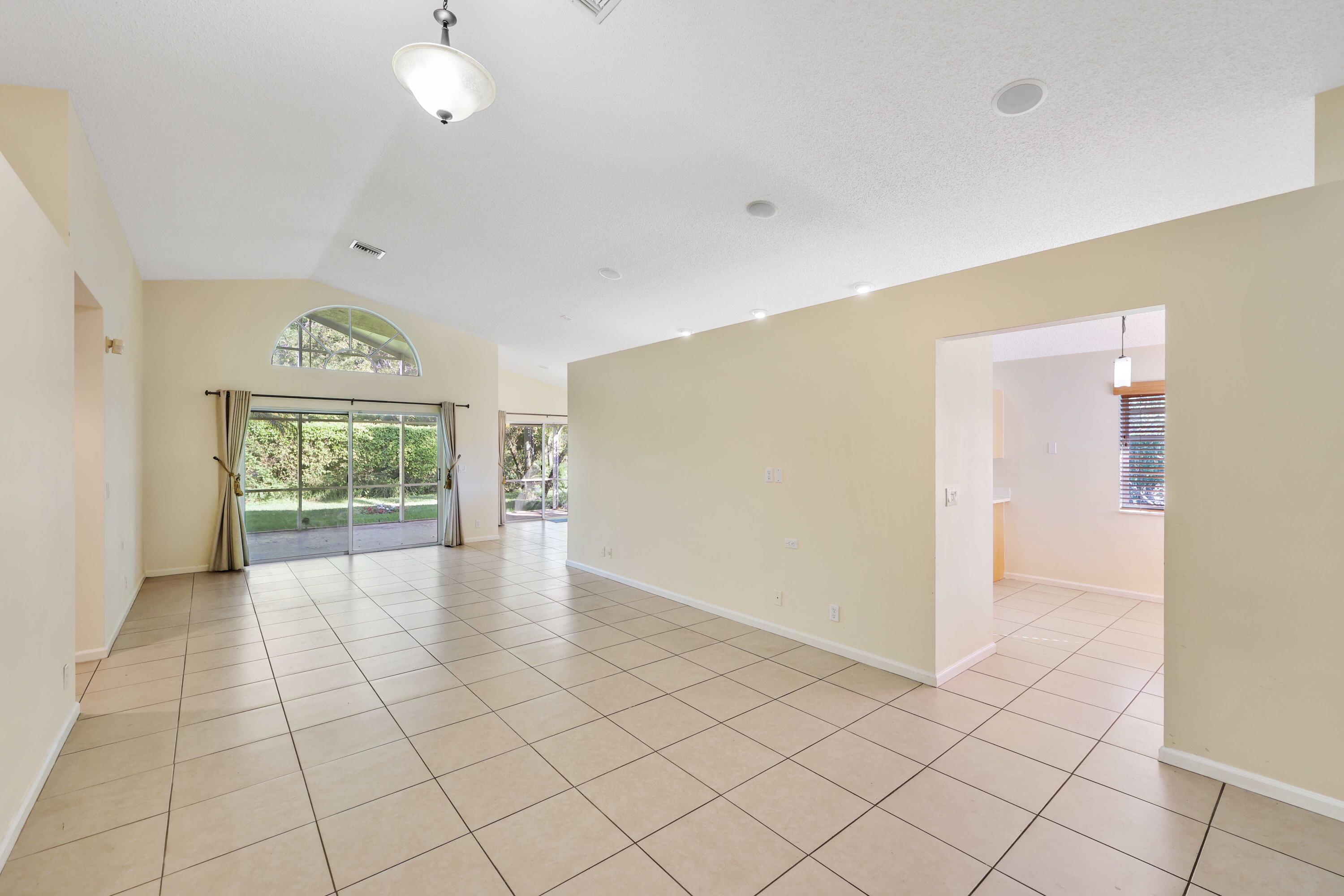 5125 Columbo Court Delray Beach, FL 33484 - Photo 13 of 60 an empty room with windows and closet