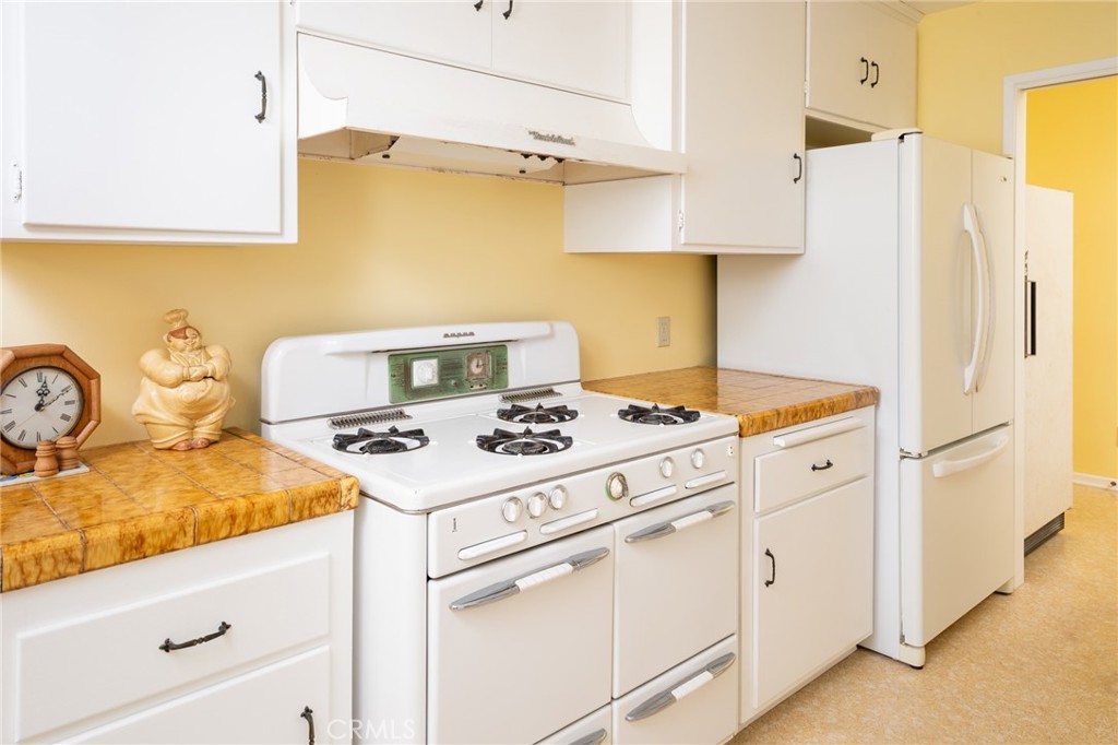 219 Esplanade San Clemente, CA 92672 - Photo 16 of 63 a kitchen with a stove and a refrigerator