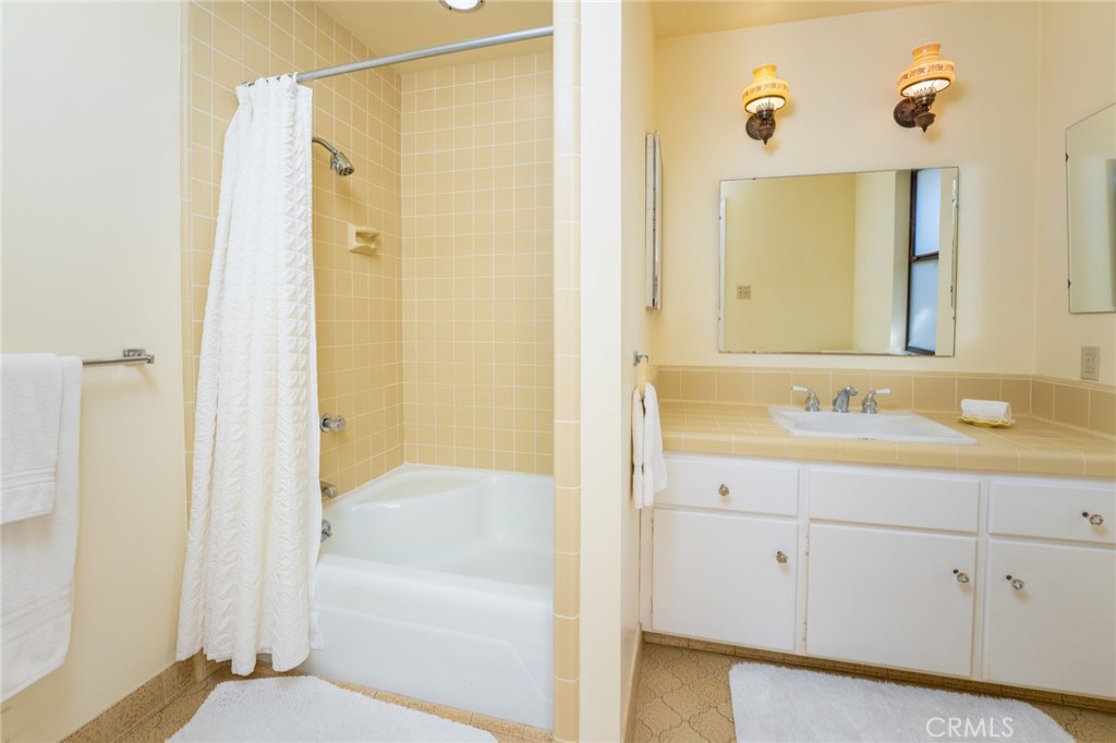 219 Esplanade San Clemente, CA 92672 - Photo 26 of 63 a bathroom with a tub sink and mirror