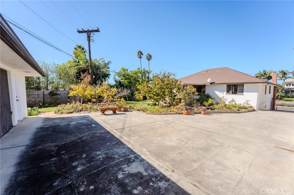 219 Esplanade San Clemente, CA 92672 - Photo 31 of 63 a view of a garden with a table and chairs under an umbrella