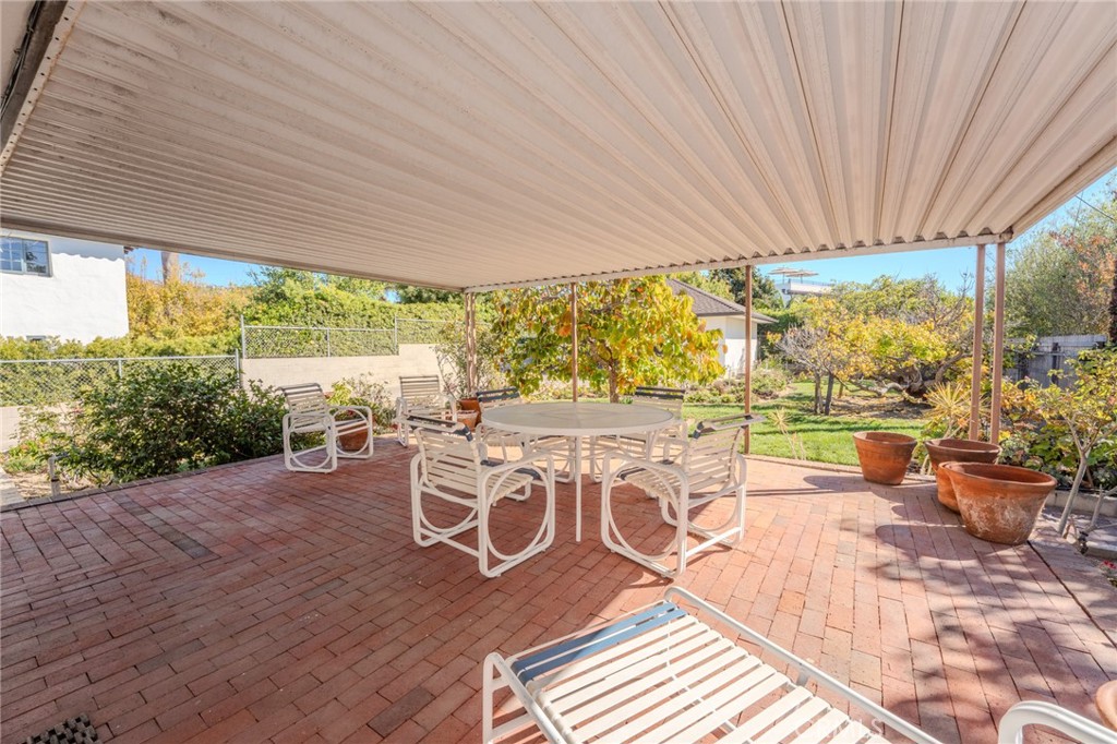 219 Esplanade San Clemente, CA 92672 - Photo 33 of 63 a view of a patio with a table chairs and wooden floor