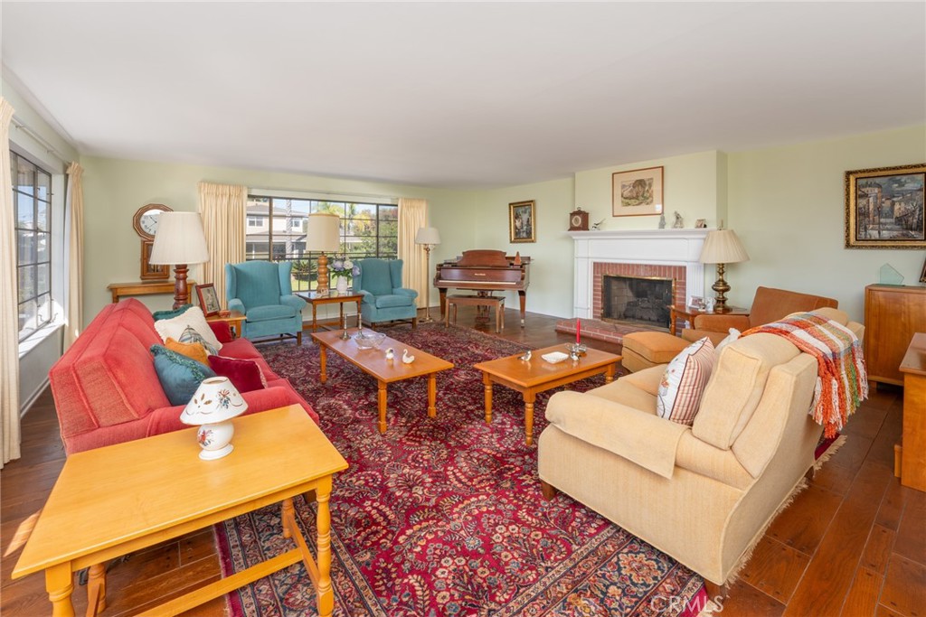 219 Esplanade San Clemente, CA 92672 - Photo 8 of 63 Great size living room with a cozy fireplace and custom dumbwaiter. Enjoy the ocean view and stunning sunsets from this room.