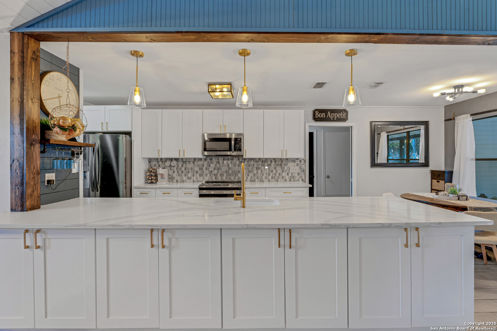 2665 Casey Road Bulverde, TX 78163 - Photo 14 of 42 a kitchen with stainless steel appliances granite countertop a sink a stove and a refrigerator