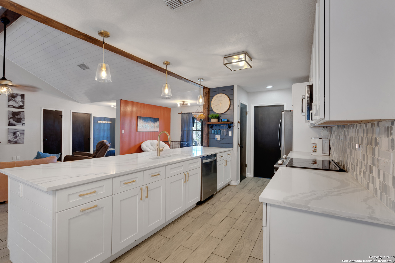 2665 Casey Road Bulverde, TX 78163 - Photo 16 of 42 a kitchen with white cabinets and stainless steel appliances