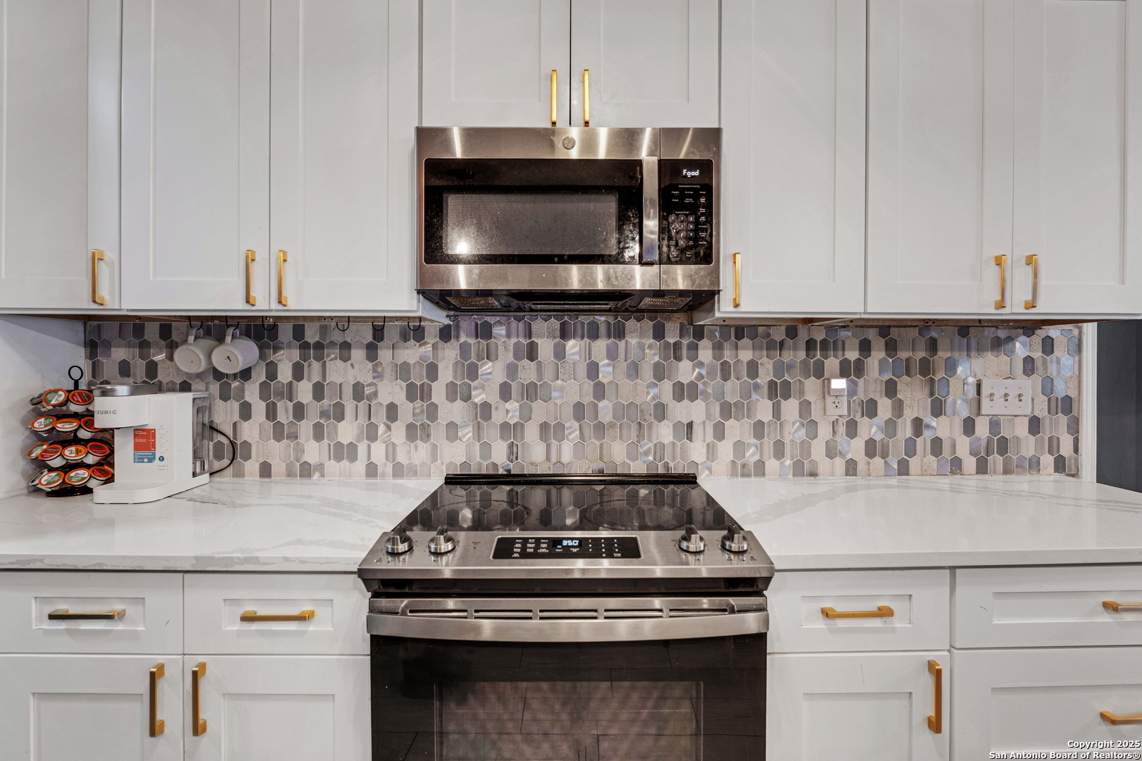 2665 Casey Road Bulverde, TX 78163 - Photo 18 of 42 a kitchen with a stove and a microwave