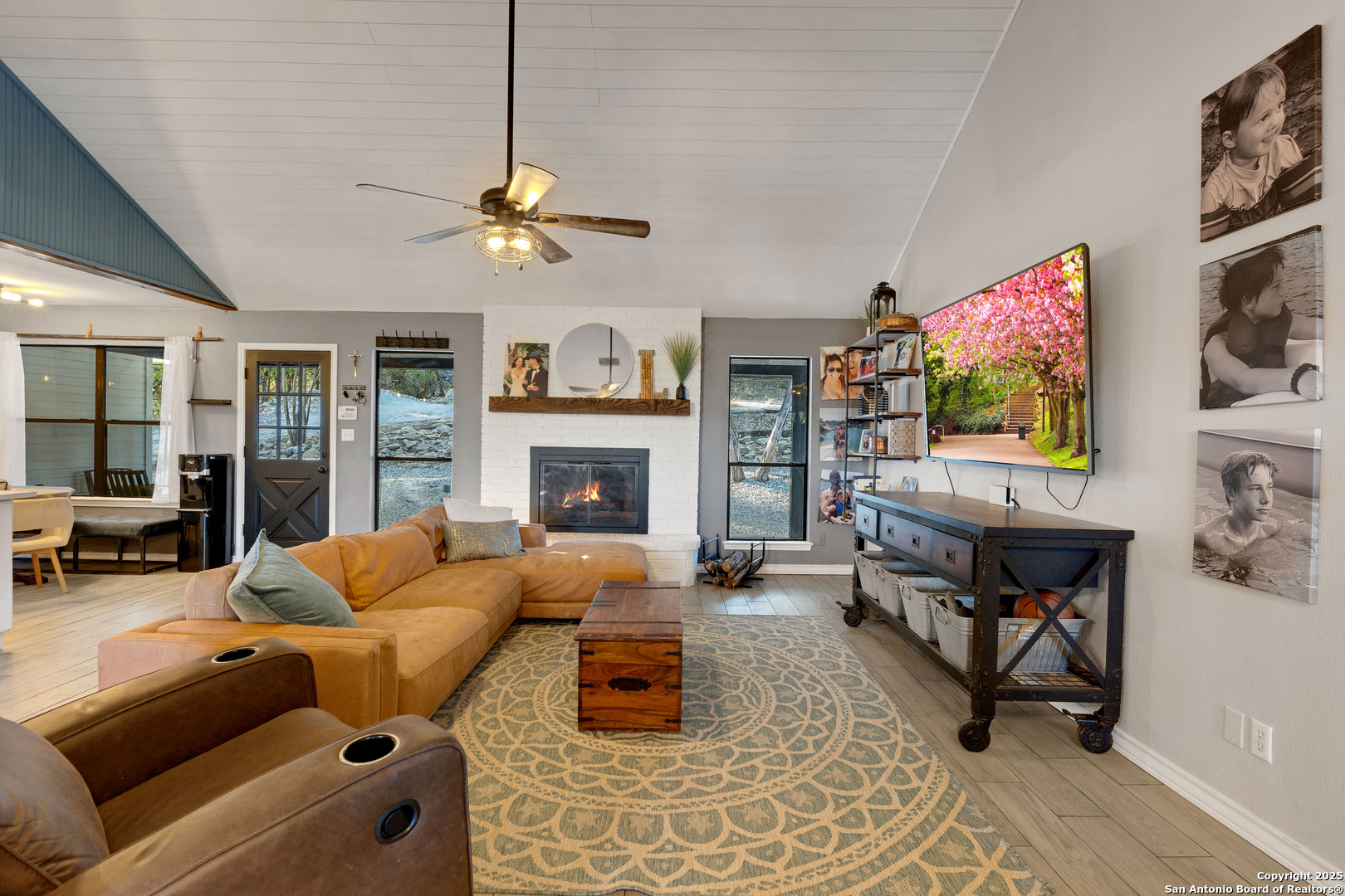 2665 Casey Road Bulverde, TX 78163 - Photo 24 of 42 a living room with furniture or couch and a fireplace
