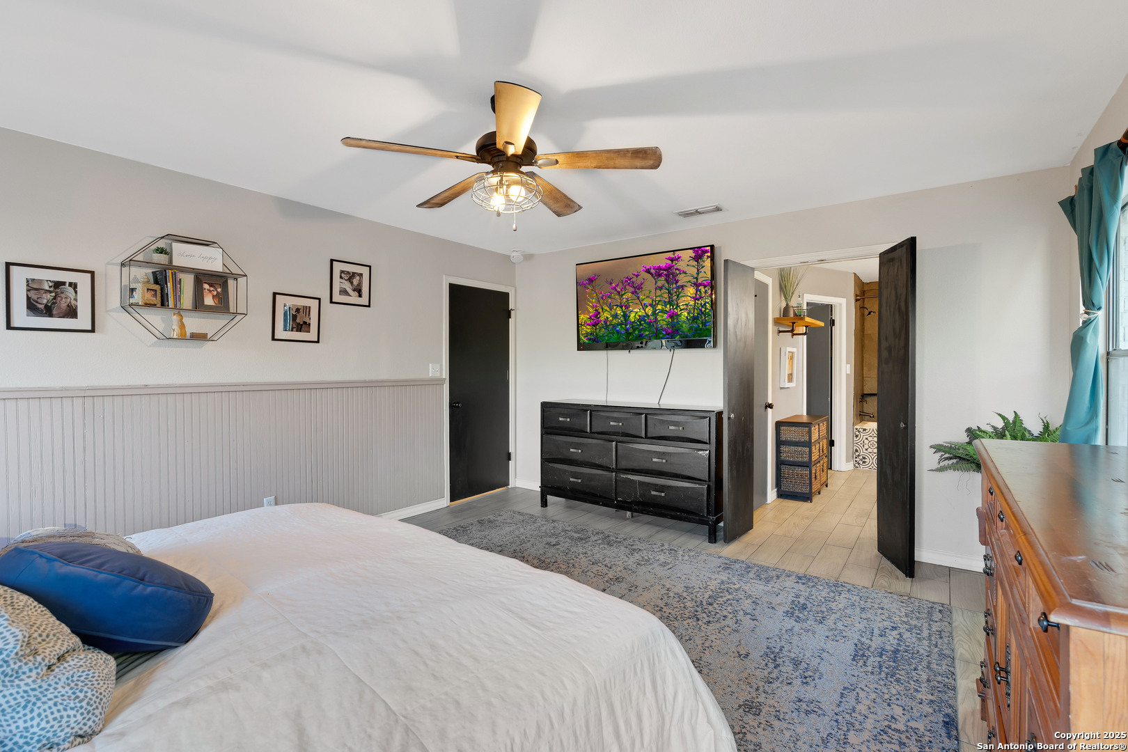 2665 Casey Road Bulverde, TX 78163 - Photo 30 of 42 a bedroom with a bed and a flat screen tv