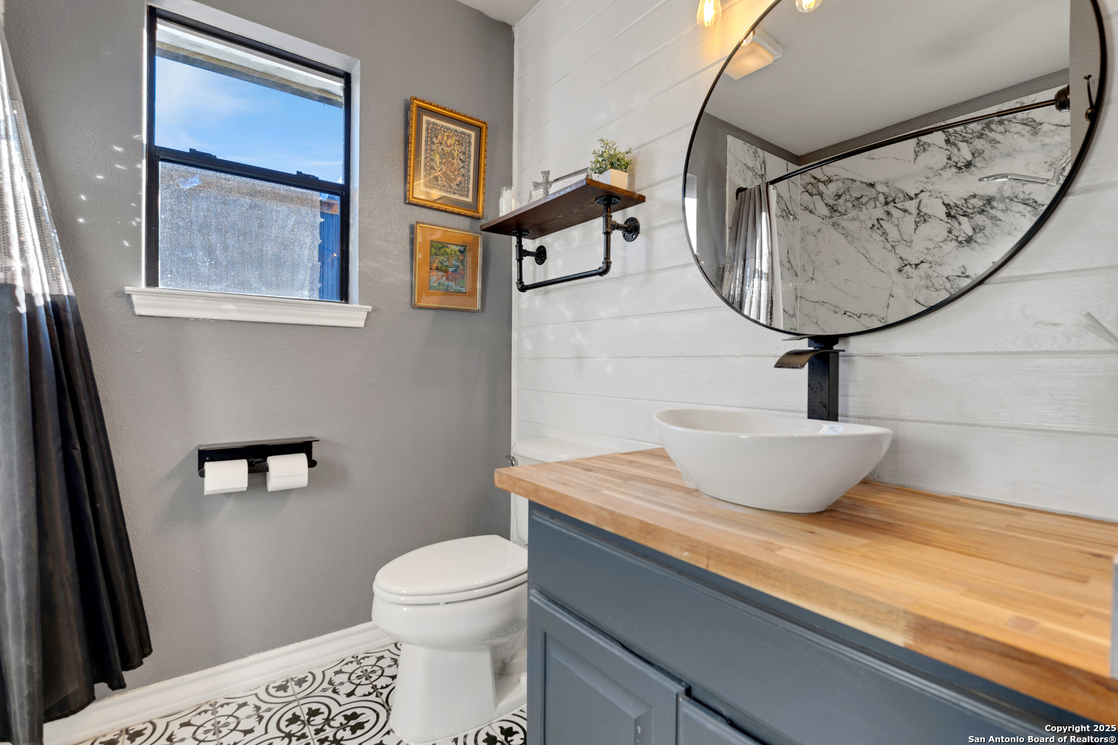 2665 Casey Road Bulverde, TX 78163 - Photo 34 of 42 a bathroom with a toilet a sink and mirror