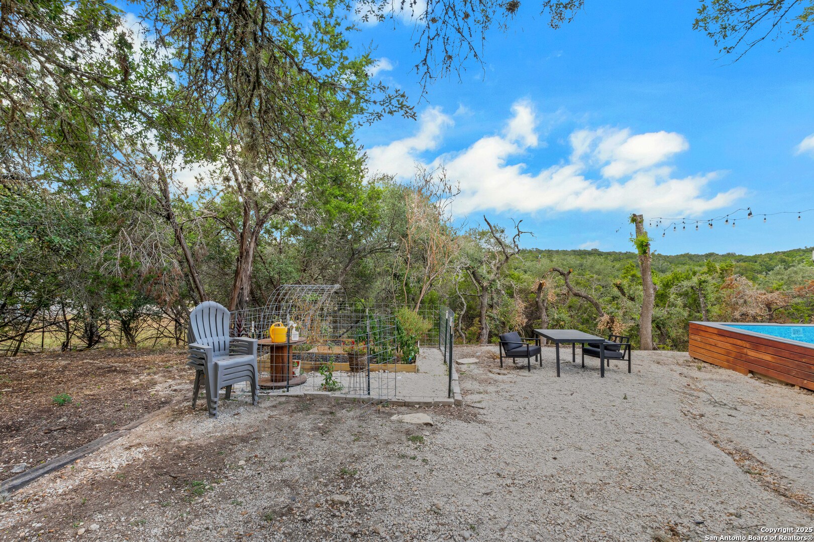 2665 Casey Road Bulverde, TX 78163 - Photo 38 of 42 a view of a two chairs in a backyard