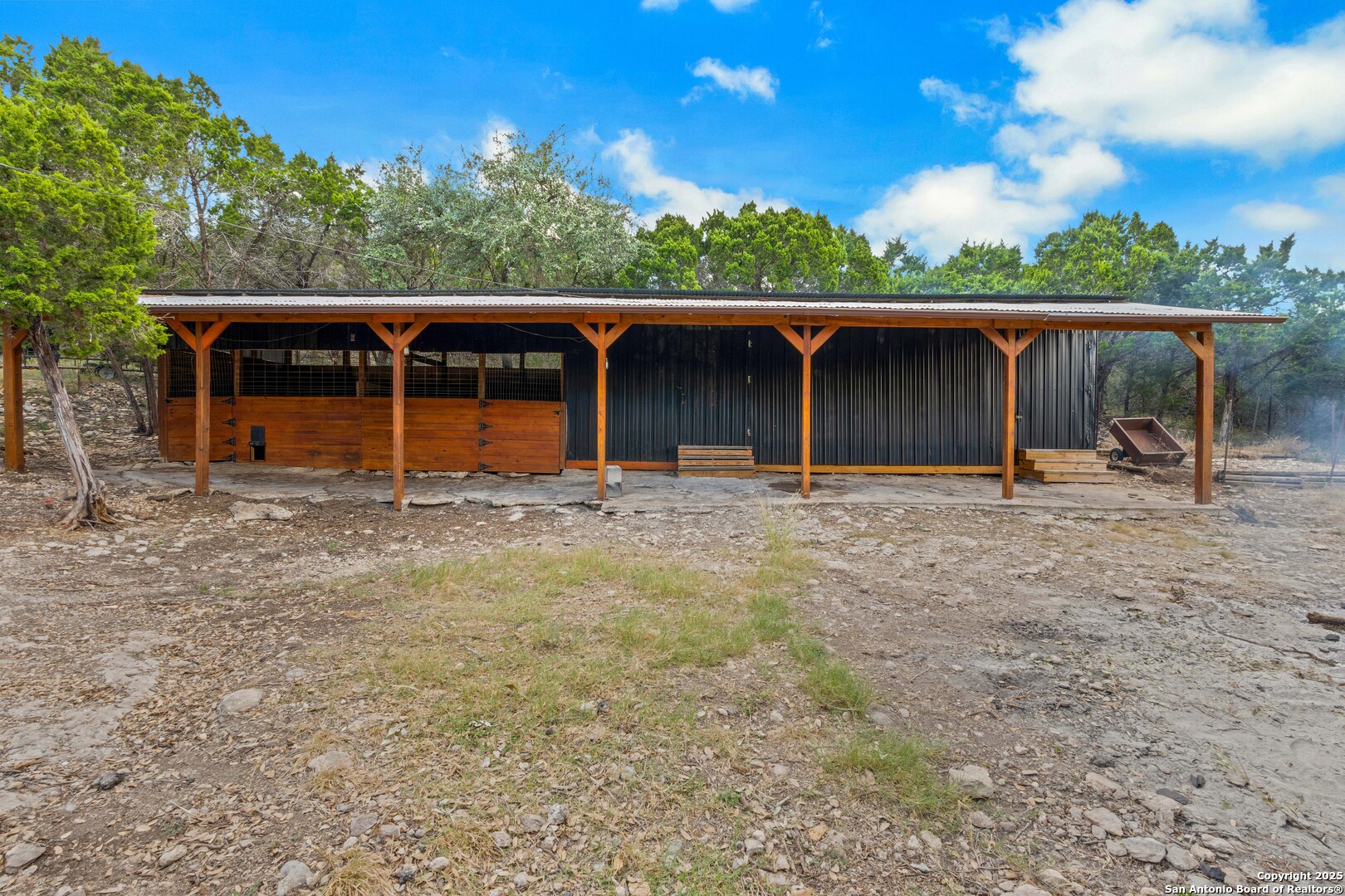 2665 Casey Road Bulverde, TX 78163 - Photo 39 of 42 a backyard of a house with barbeque oven and barbeque oven