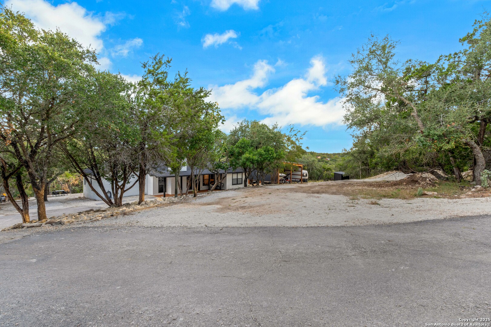 2665 Casey Road Bulverde, TX 78163 - Photo 41 of 42 a view of road and side view of house