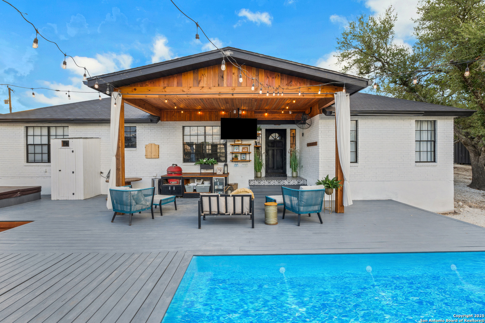 2665 Casey Road Bulverde, TX 78163 - Photo 5 of 42 a view of a patio with table and chairs with wooden floor and fence