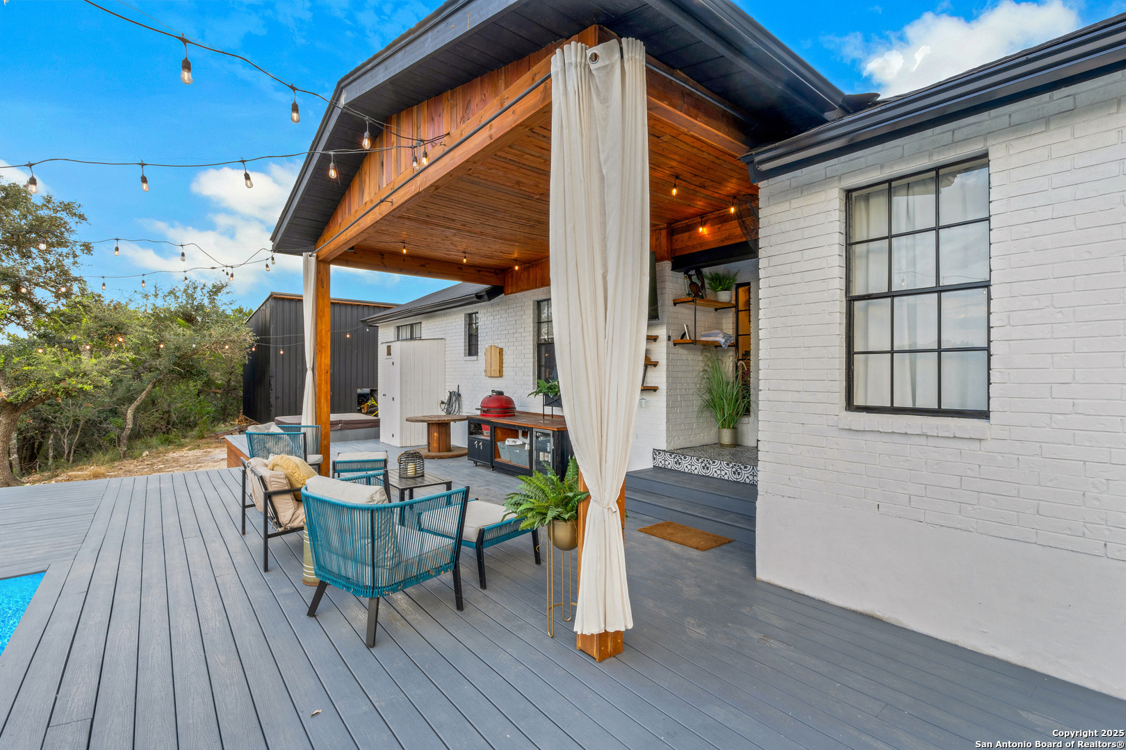 2665 Casey Road Bulverde, TX 78163 - Photo 9 of 42 a view of a porch with furniture and wooden floor