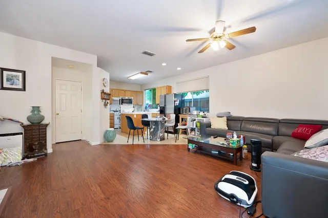 a living room with furniture fireplace and window