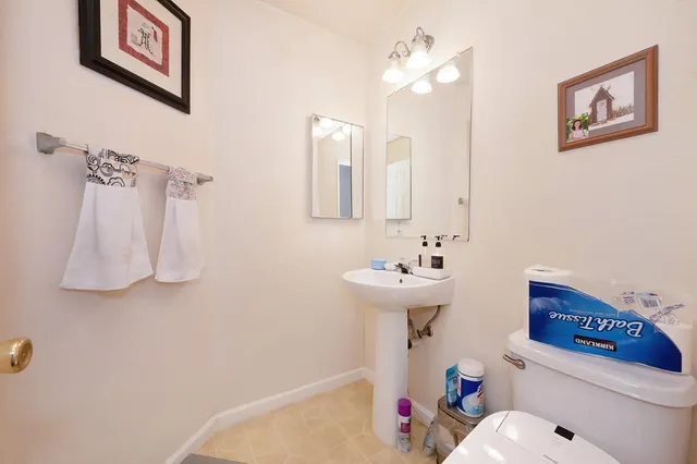 a view of hallway with wooden floor