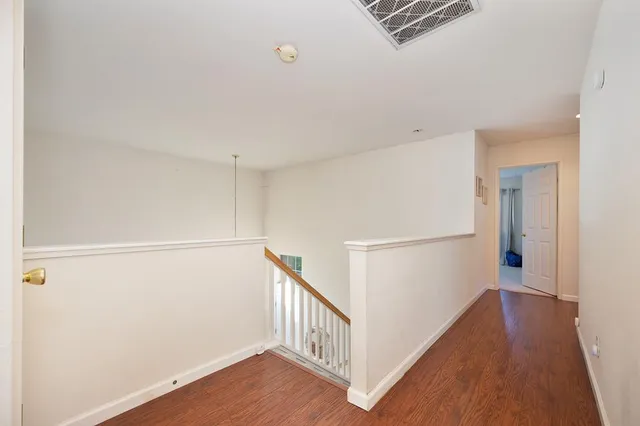a spacious bathroom with a tub sink and mirror