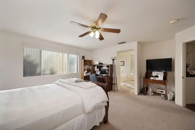 a bed room with furniture and a window