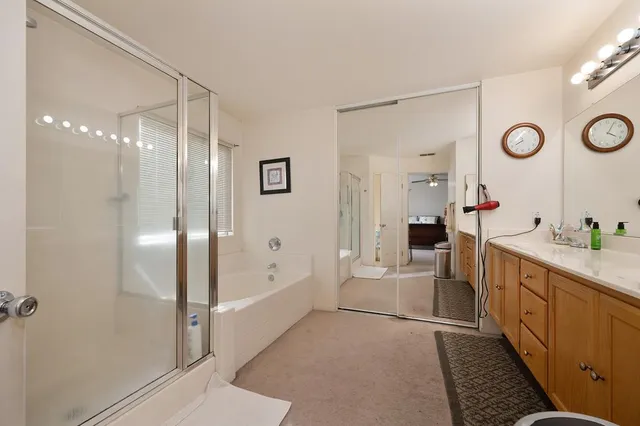 a bedroom with a bed furniture and closet