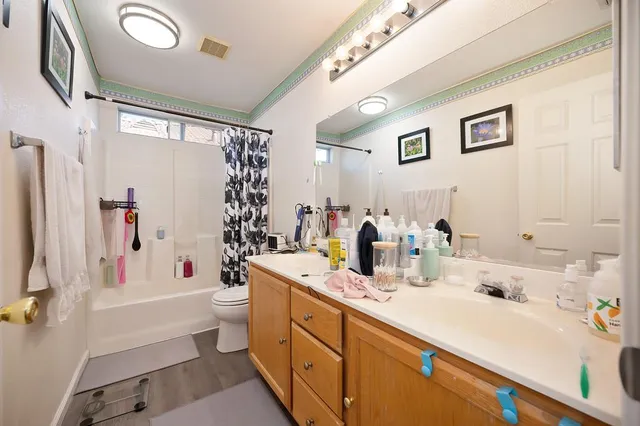 a view of a swimming pool with lawn chairs and couches