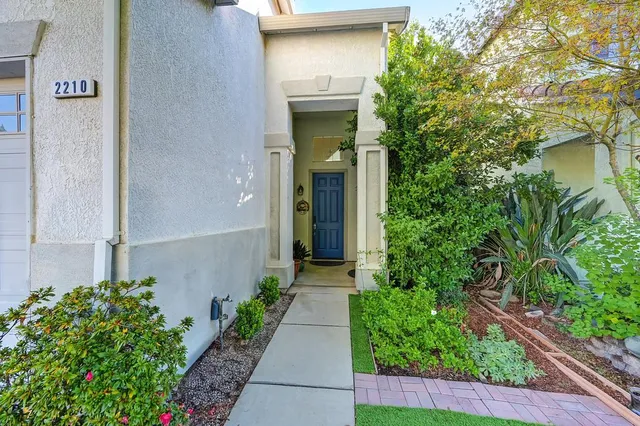 a view of a wooden bench in front of a house
