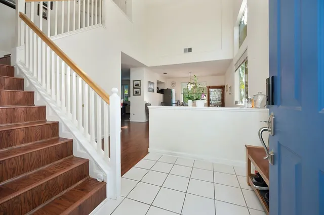 a view of a livingroom with furniture wooden floor and window