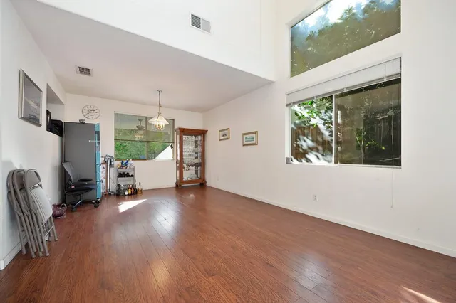a view of a livingroom with furniture and a mirror