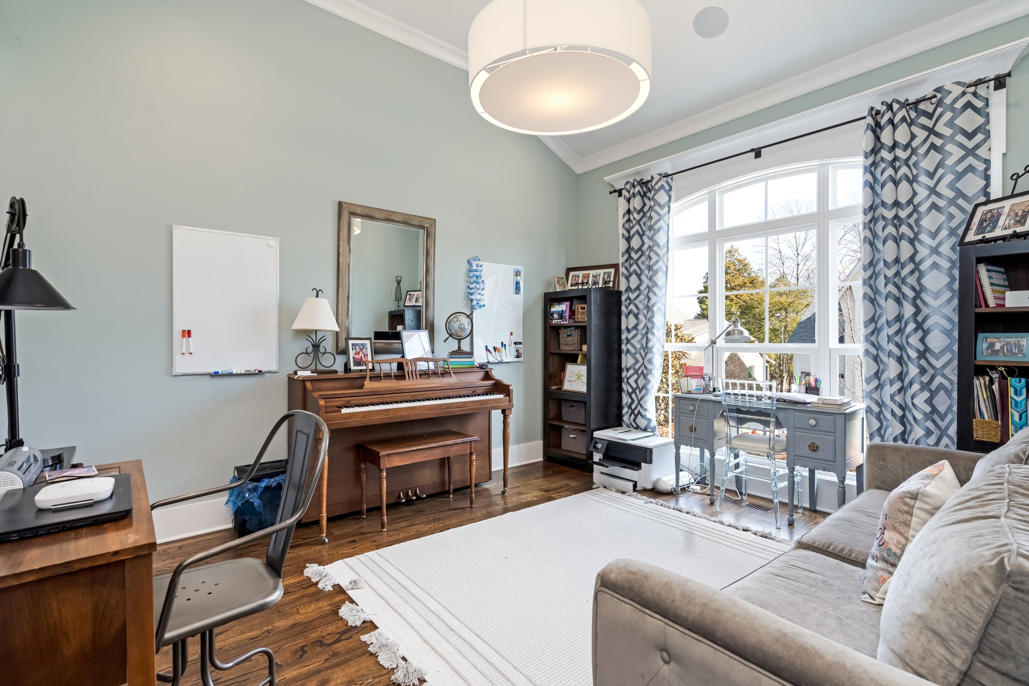325 Circuit Road Franklin, TN 37064 - Photo 27 of 55 a living room with furniture a window and a chandelier