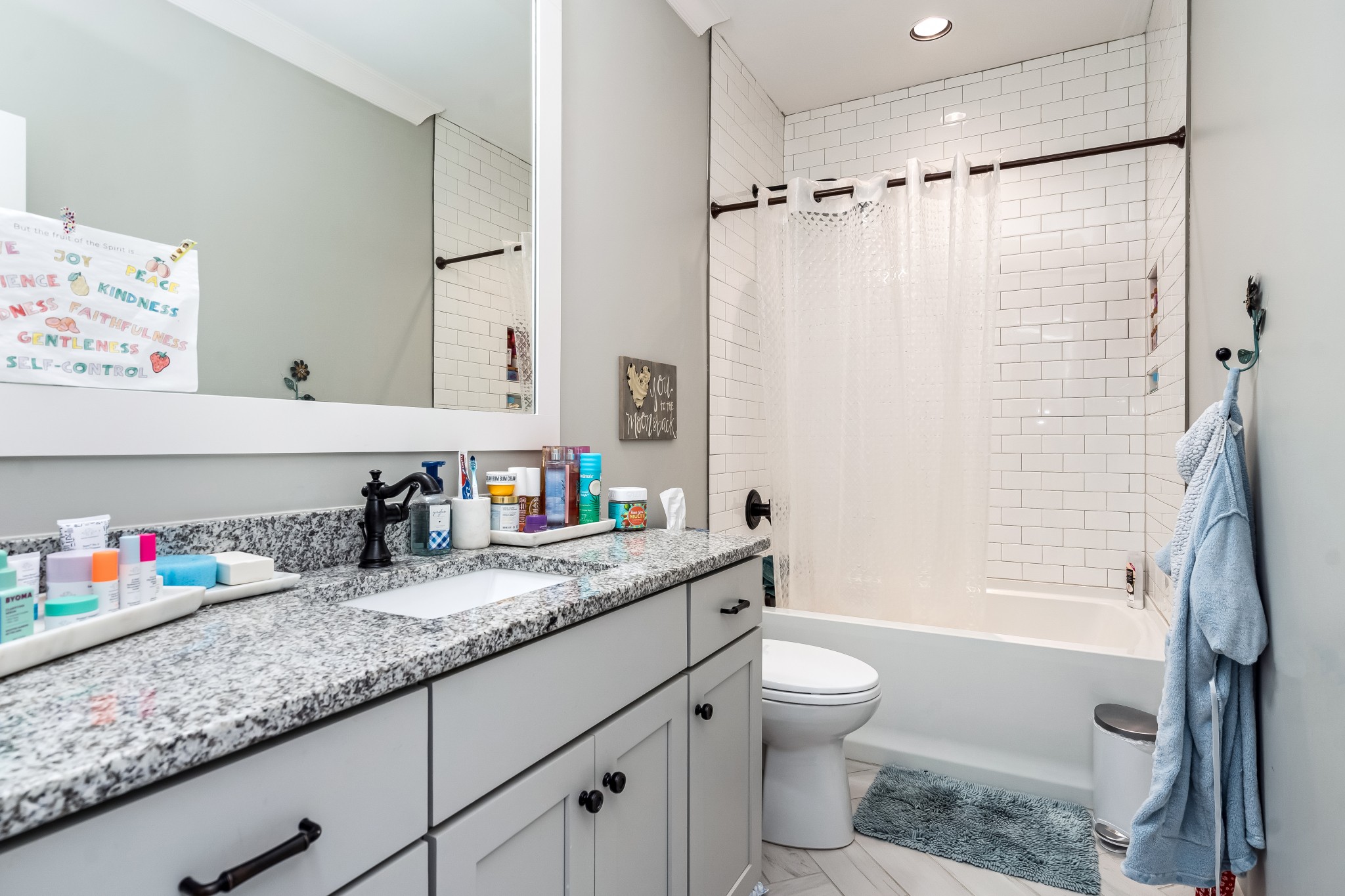 325 Circuit Road Franklin, TN 37064 - Photo 44 of 55 a bathroom with a granite countertop sink a toilet a shower curtain and a bath tub